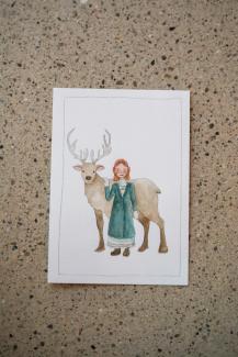 a Christmas card, girl with a reindeer