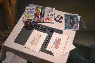my table where I illustrated the guests, my watercolours, live illustrations, brushes, wedding fair