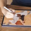 A Hand drawing with an apple pencil on an ipad