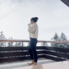 me on a balcony drinking coffee. winter landscape. snow. 