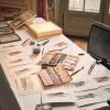 Where I work as a wedding illustration artist,  a table in a castle, illustrations, watercolours and other tools on it